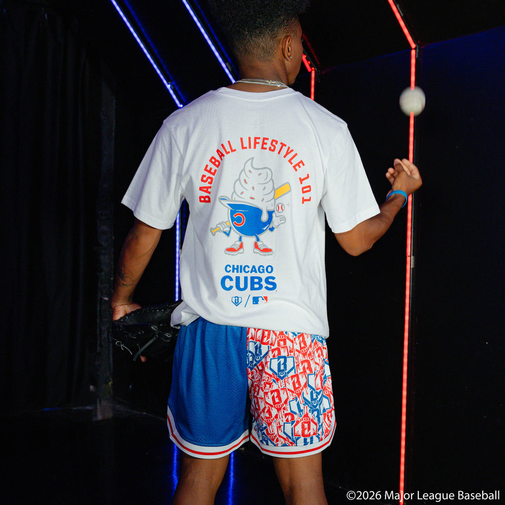 Adult model wearing blue shorts with "Chicago Cubs Sticker Court" design