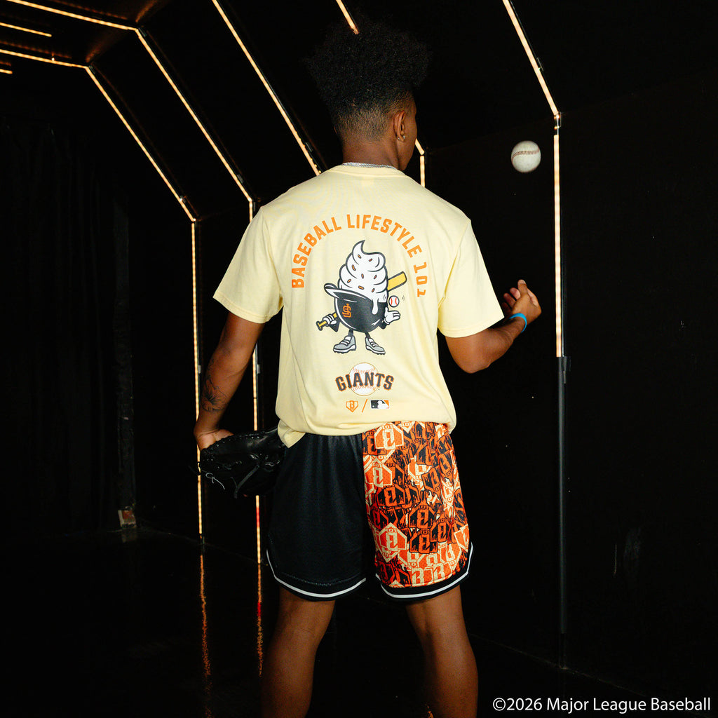 Adult model wearing black shorts with "San Francisco Giants Sticker Court" design