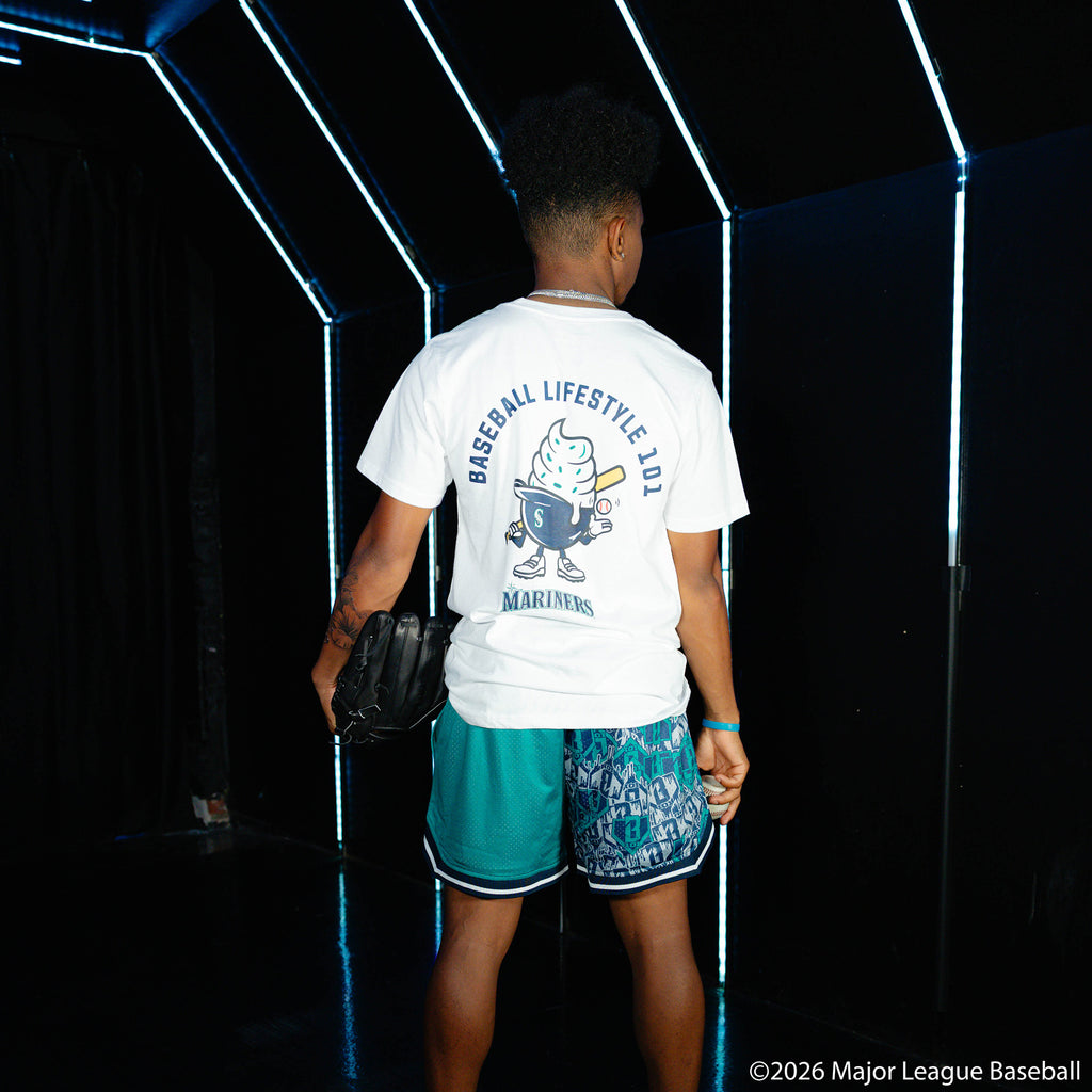 Adult model wearing green shorts with "Seattle Mariners Sticker Court" design
