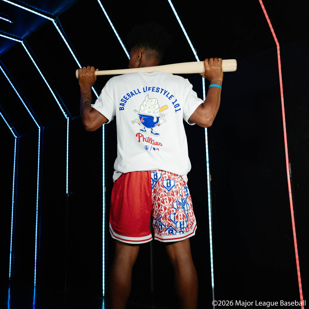 Adult model wearing red shorts with "Philadelphia Phillies Sticker Court" design