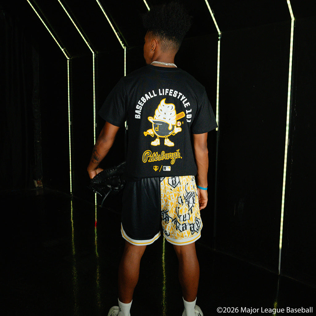 Adult model wearing black shorts with "Pittsburgh Pirates Sticker Court" design