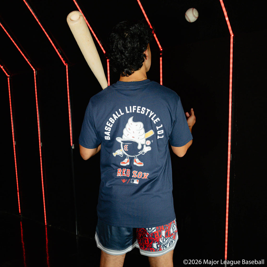 Adult model wearing navy shorts with "Boston Red Sox Sticker Court" design