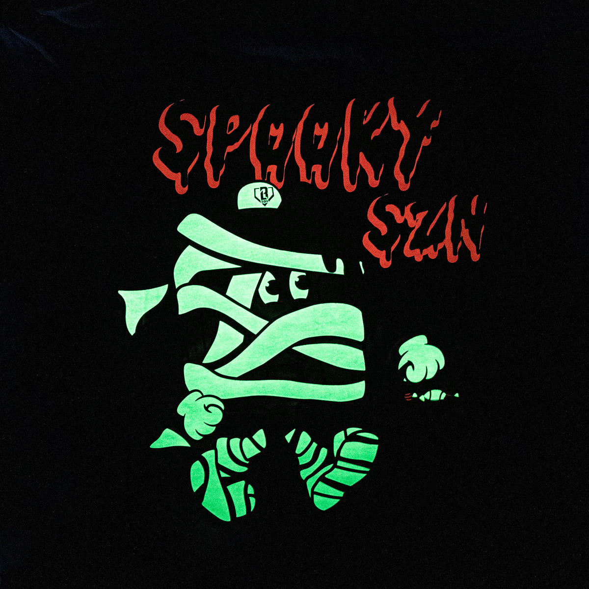 Adult model wearing blue graphic tee with "Spooky SZN Waffle" design
