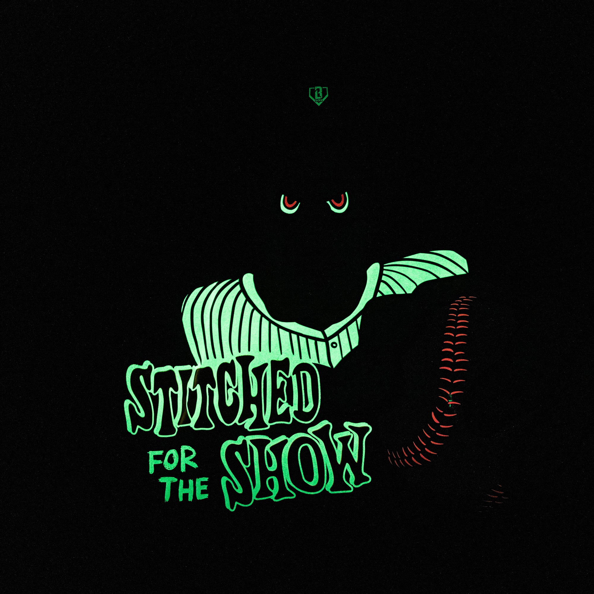 Adult model wearing black graphic tee with "Stitched For The Show" design