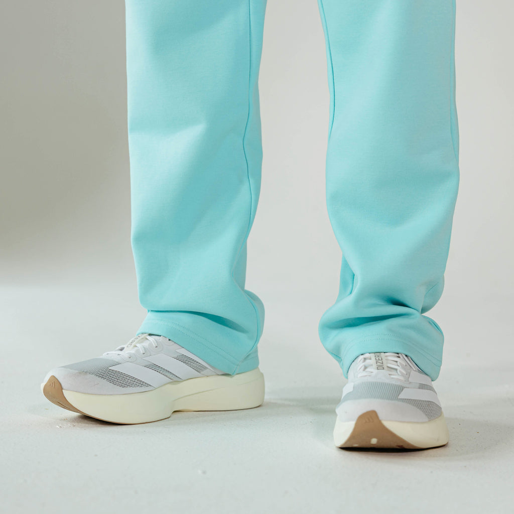 Adult model wearing Blue Baseline Straight Leg sweatpants