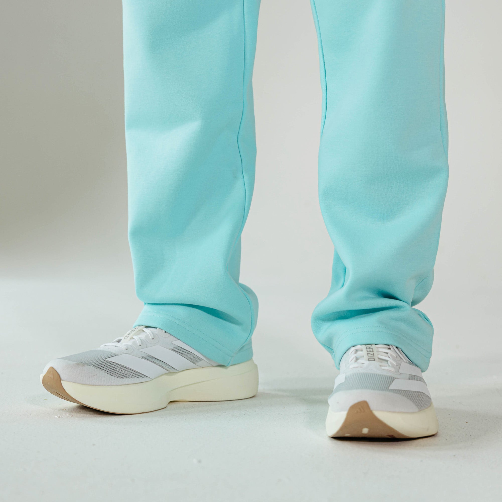 Adult model wearing Blue Baseline Straight Leg sweatpants