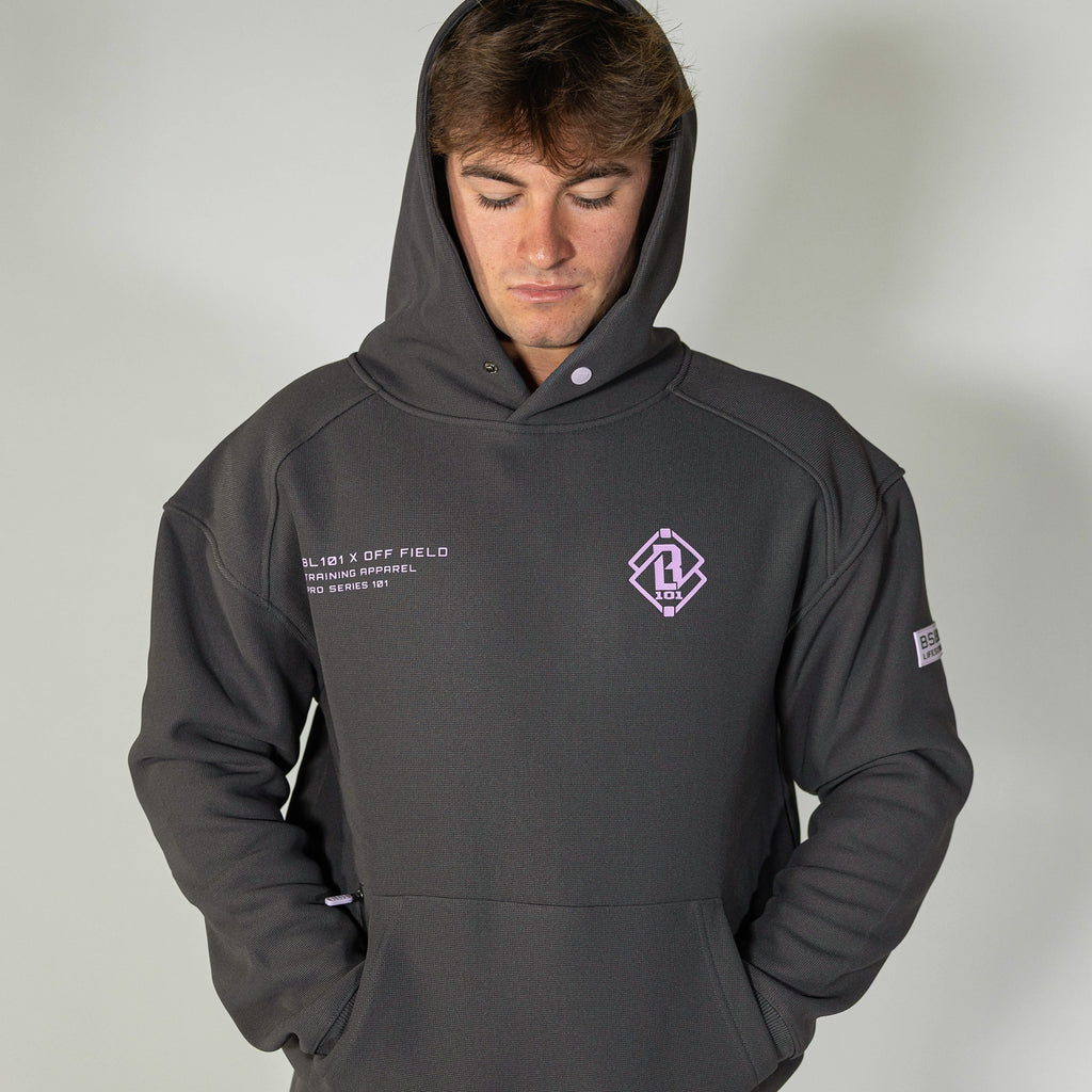 Adult model wearing gray and lilac Off-Field Waffle Performance hoodie