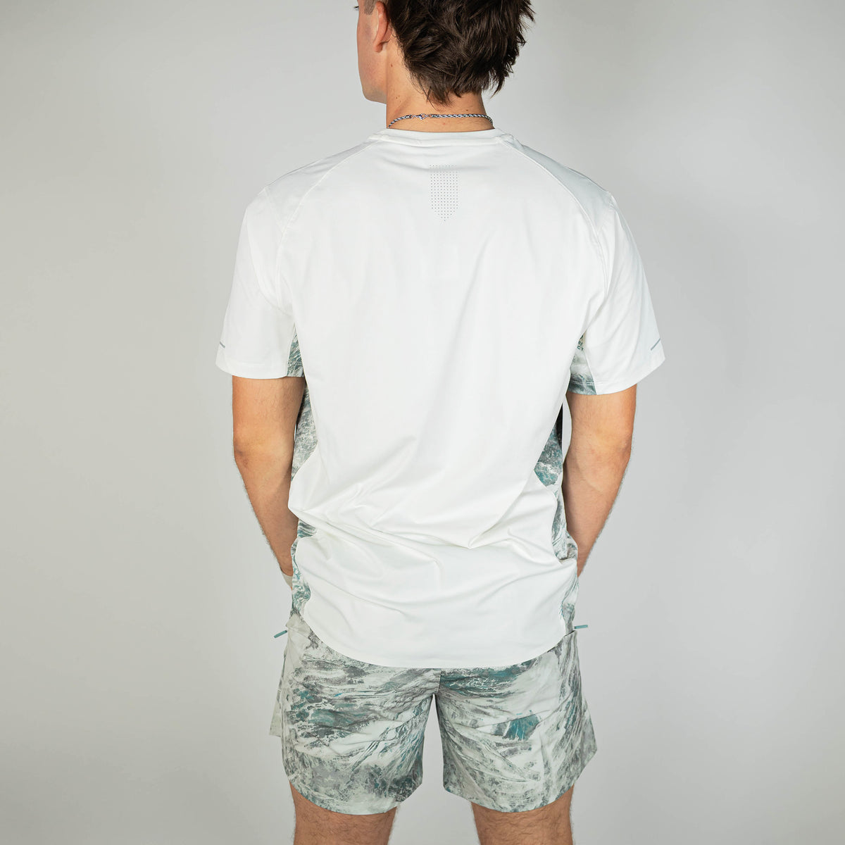 Adult model wearing gray Realtree Aspect Pro Series V2 Camo shorts with liner