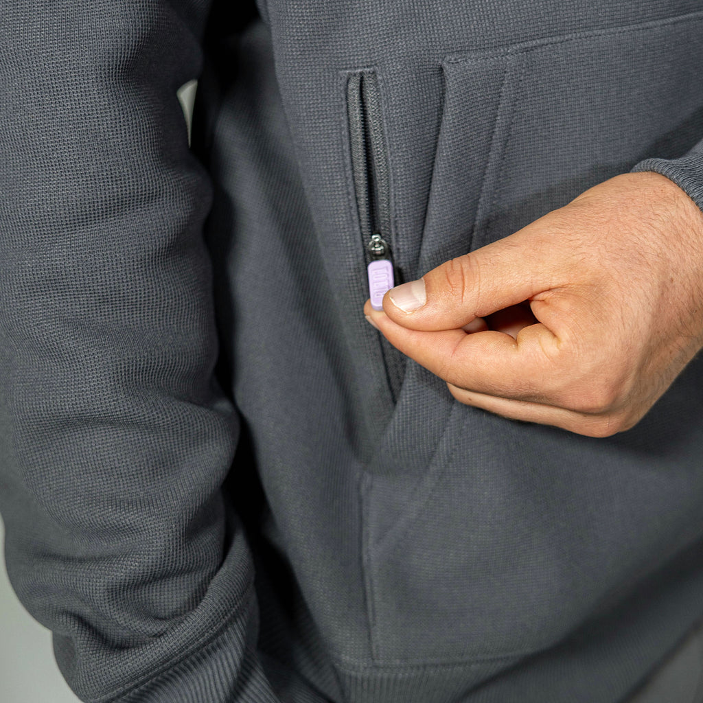 Adult model wearing gray and lilac Off-Field Waffle Performance hoodie