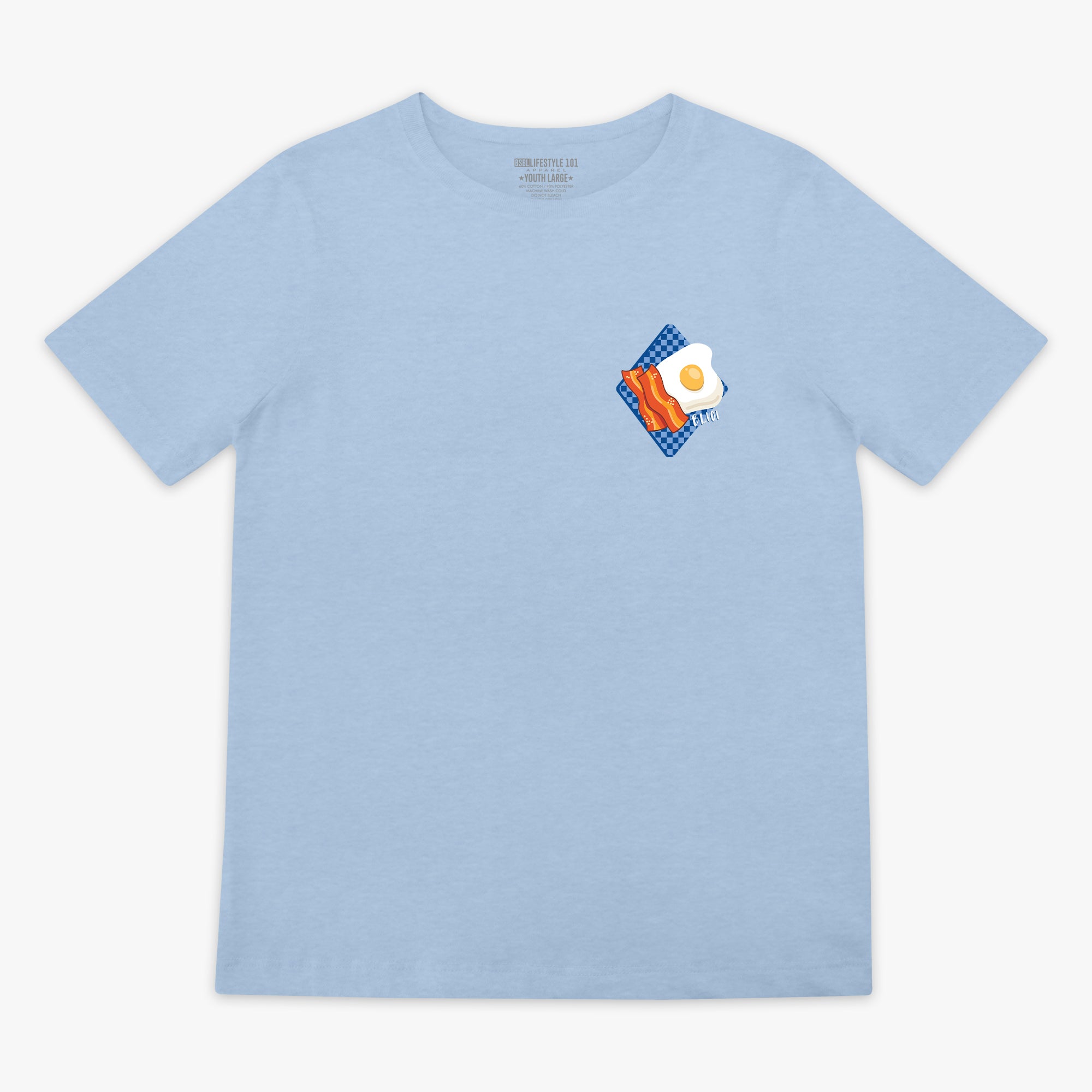 Light blue t-shirt with a graphic of an egg and bacon on a white background
