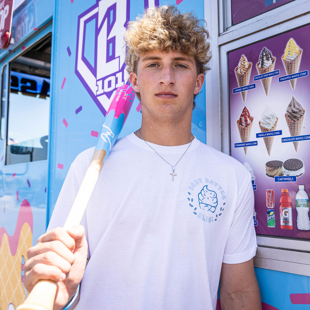 Adult model wearing white graphic tee with “Best Batter” design