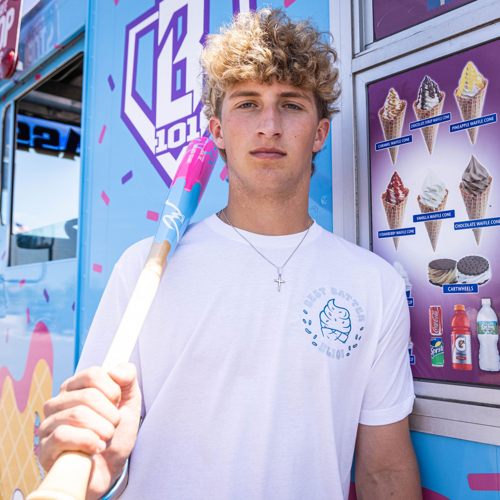 Adult model wearing white graphic tee with “Best Batter” design