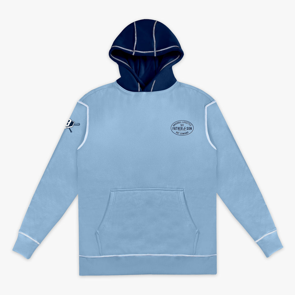 Flat lay front view of the adult columbia blue BL101 Bat Co Hoodie showing the Father & Son Bat Company chest stamp, BL101 sleeve logo, navy contrast hood, and kangaroo pocket.