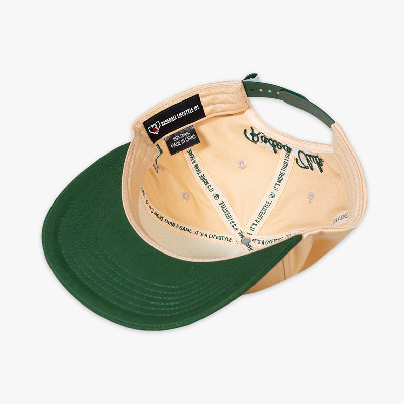Beige and green cap with text on a white background