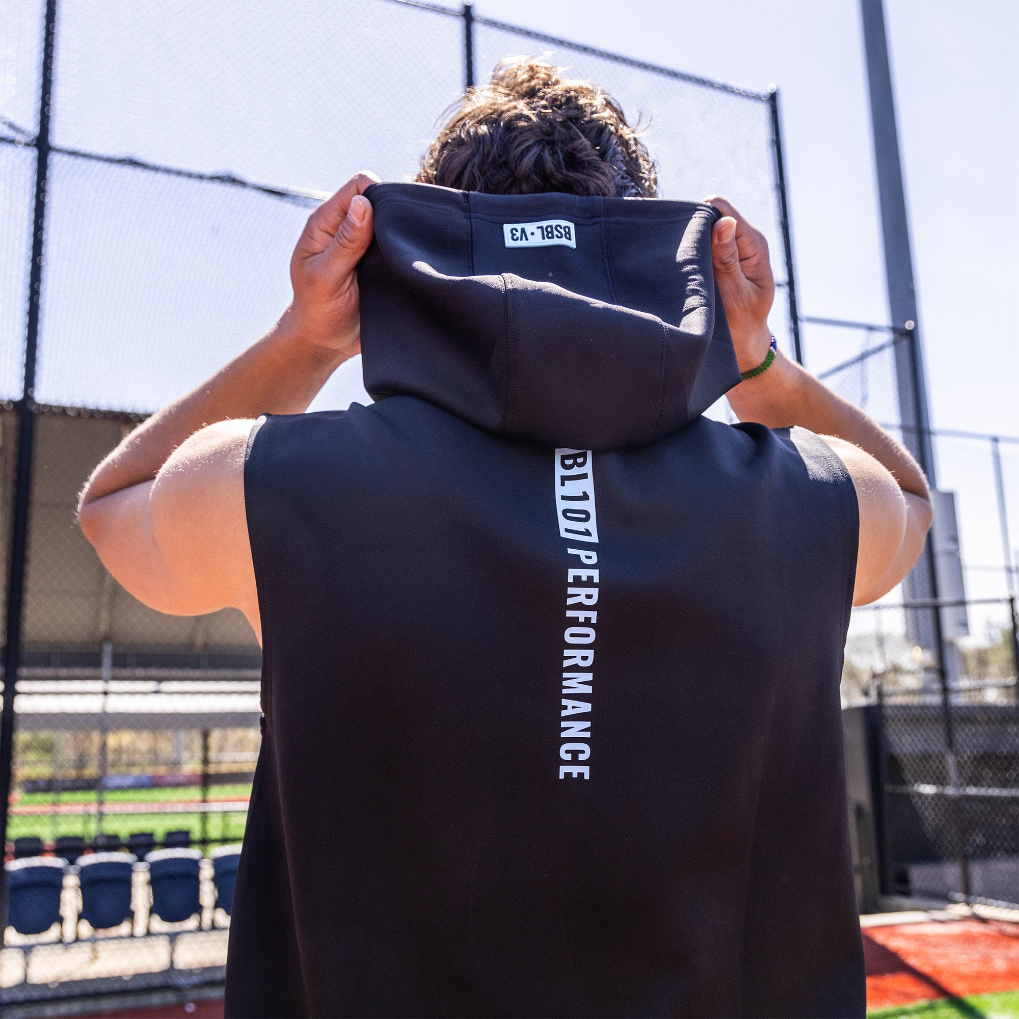 Adult model wearing black and light blue BSBL-SZN Sleeveless hoodie
