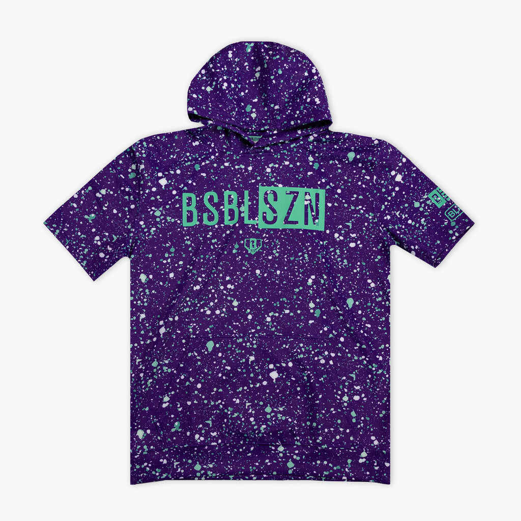 Purple splatter-patterned hoodie with green 'BSBL SZN' text on a white background