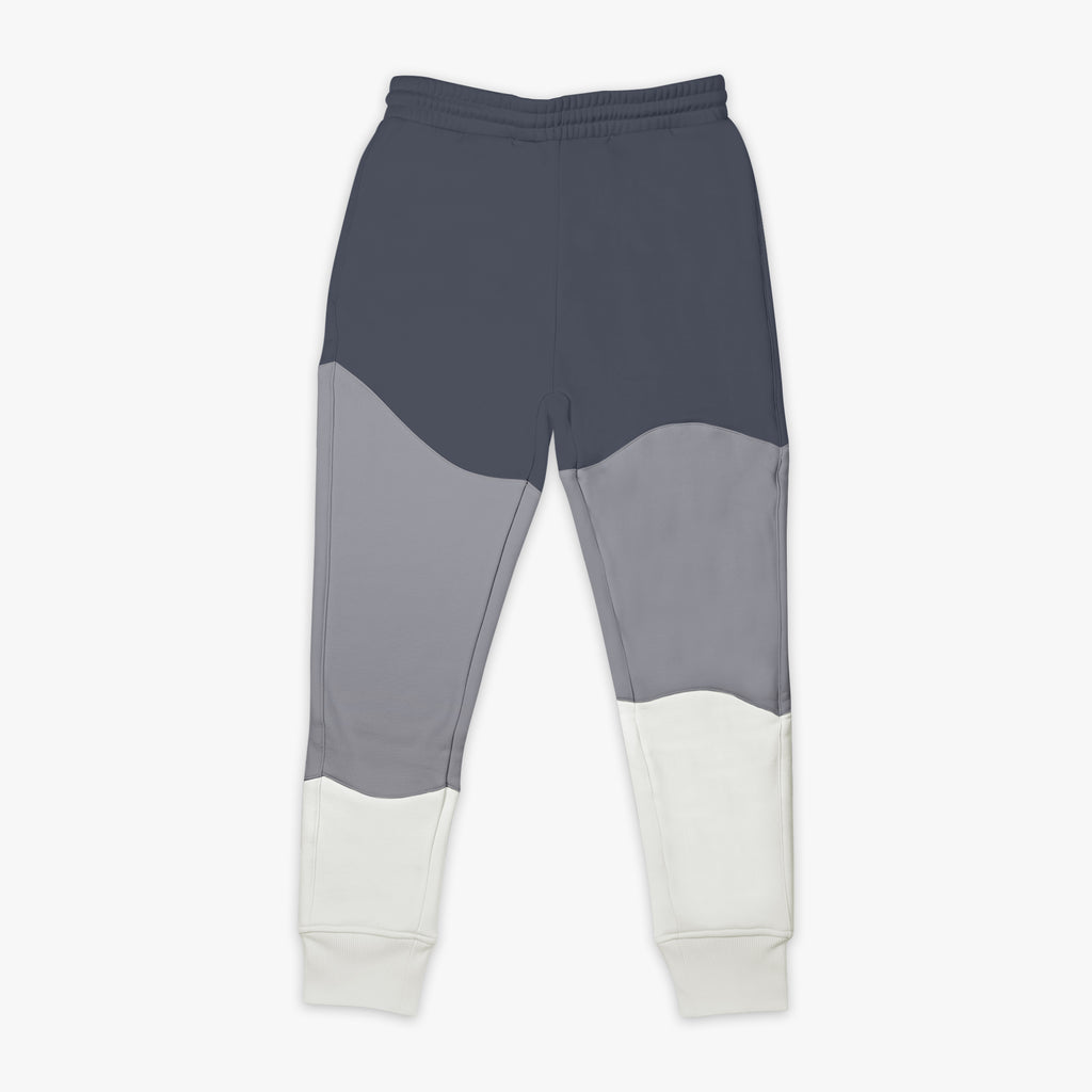 Gray and white color-blocked pants on a white background