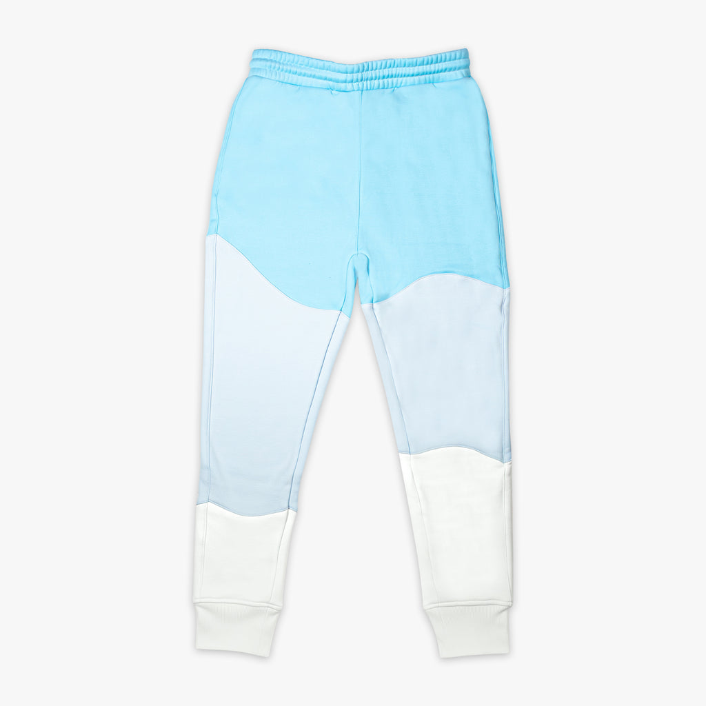 Light blue and white color-blocked sweatpants on a white background