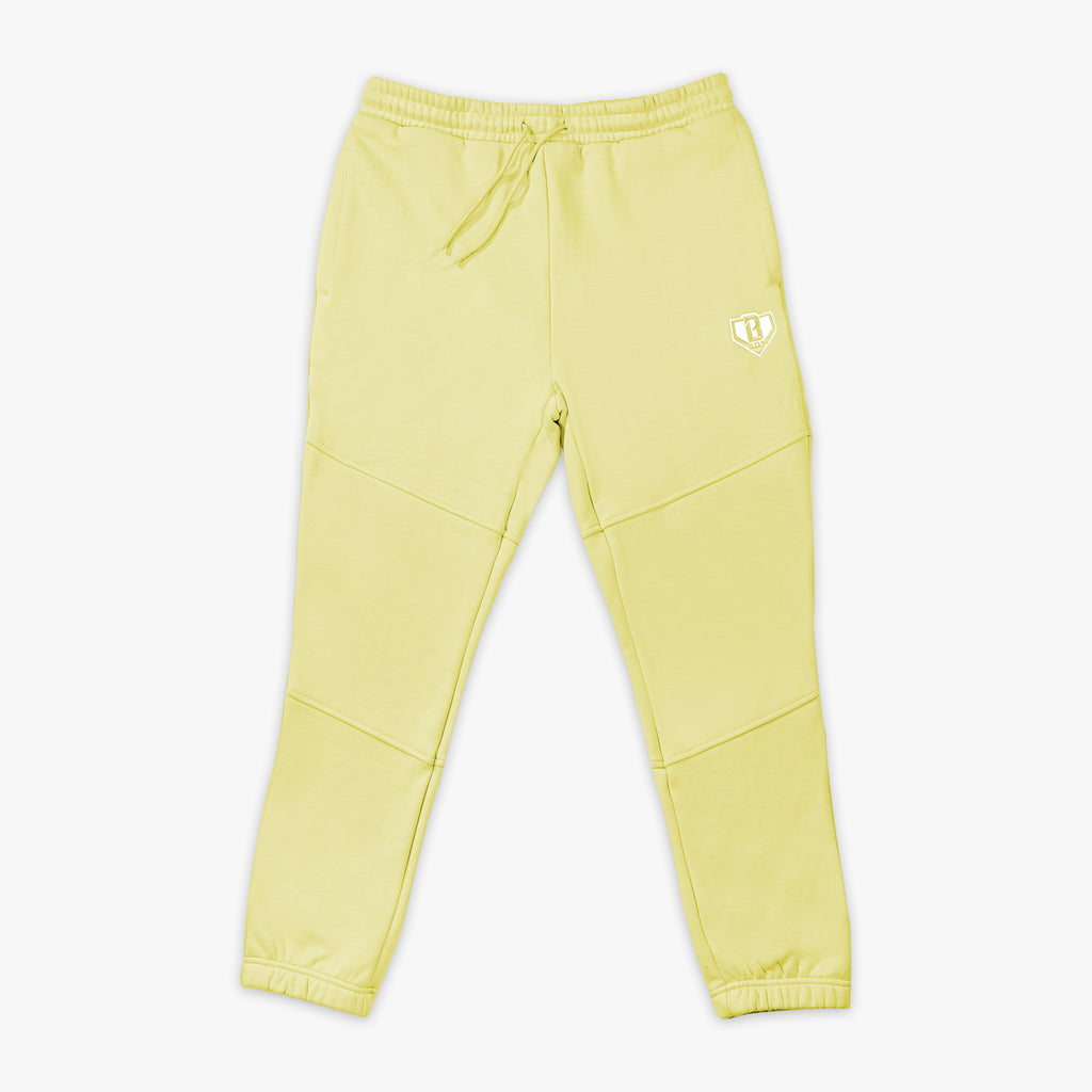 Yellow sweatpants with white BL101 logo on a white background