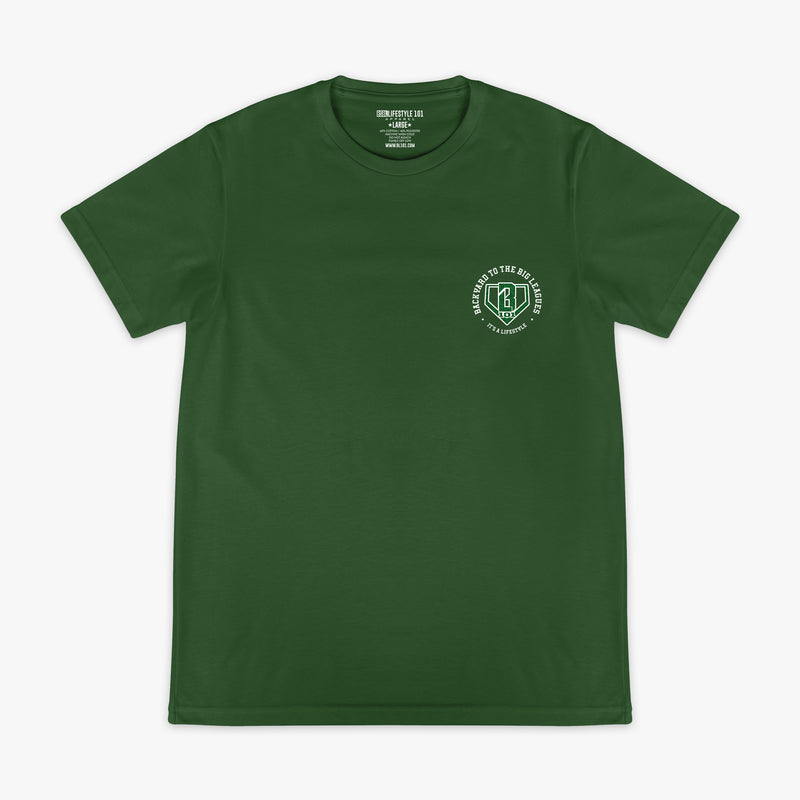 Front flat lay of the BL101 Backyard to the Big Leagues forest green tee, showing the BL101 logo on a white background.