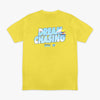 Yellow t-shirt with 'Dream Chasing' text and Pablo Sanchez design on a white background