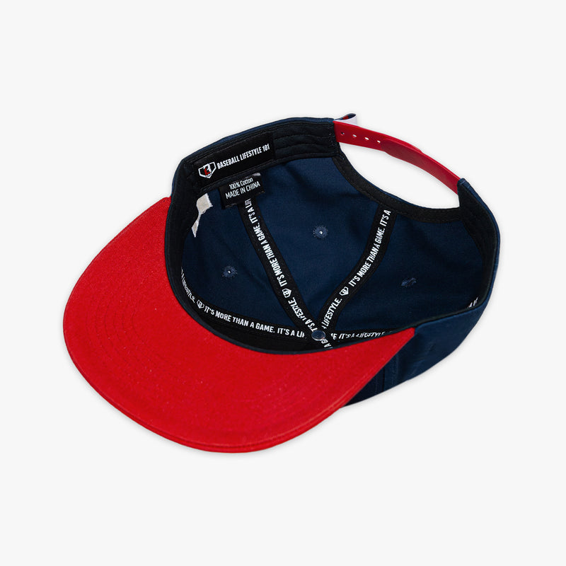 Red and navy cap with Baseball Lifestyle 101 tag