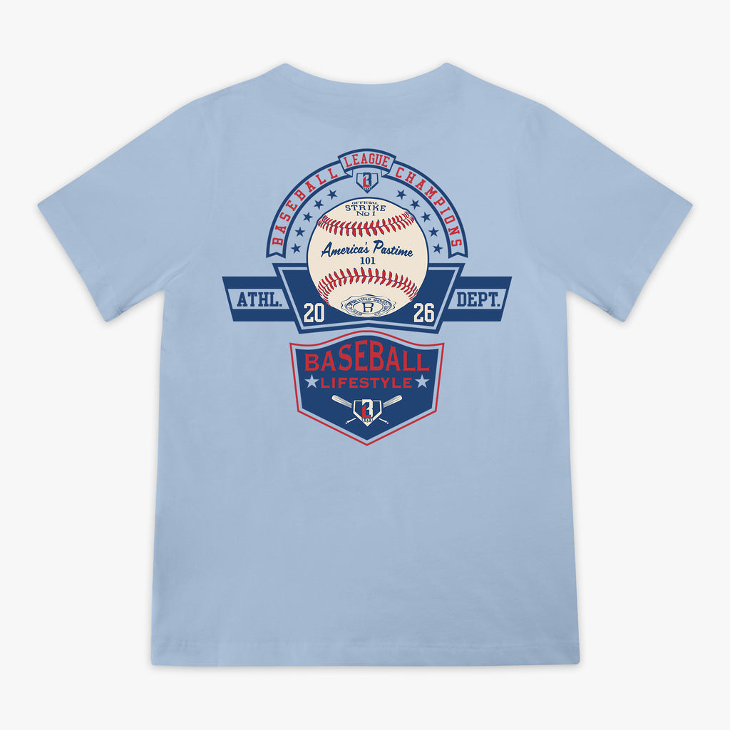 Back flat lay of the BL101 Baseball League Champions light blue tee, featuring a vintage-style "America's Pastime" baseball and Baseball Lifestyle shield graphic on a white background.