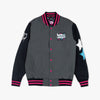 Gray and black varsity jacket with pink accents on a white background
