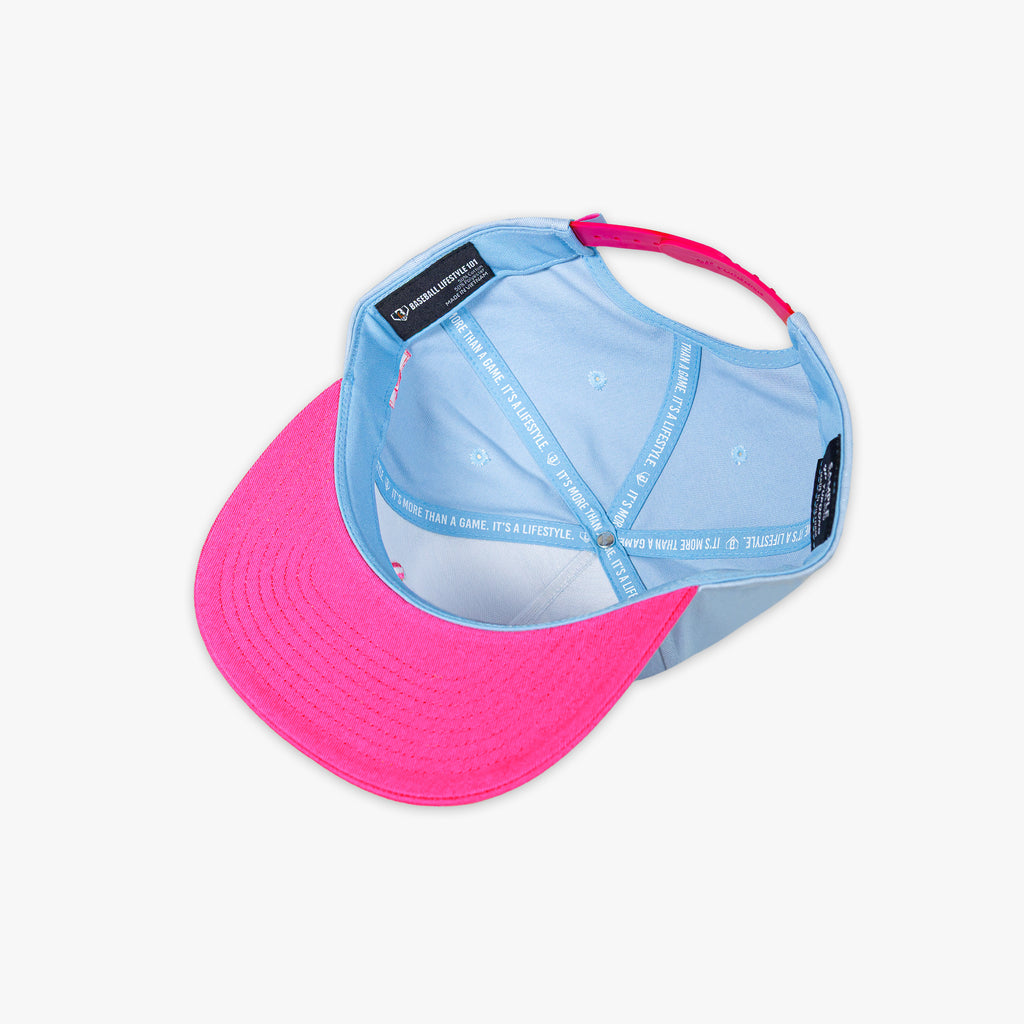 Two-tone pink and blue cap on a white background