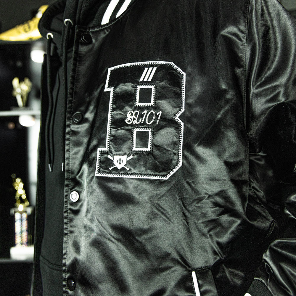 Jacket with “Baseline Satin Jacket” design — front view