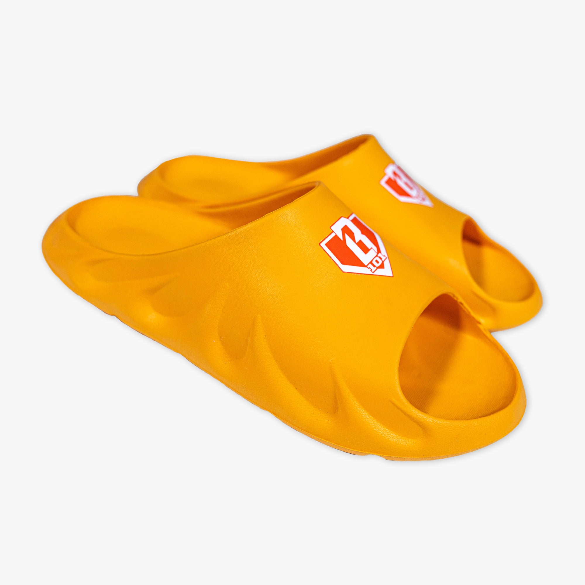 Pair of orange slides with a BL101 logo on a white background