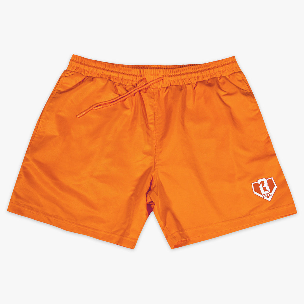 Orange shorts with a BL101 logo on a white background
