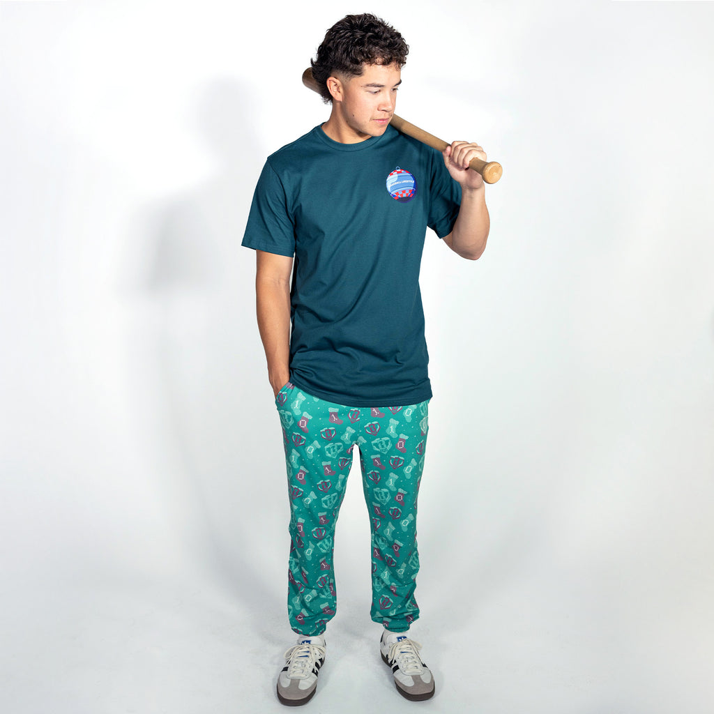 Adult model wearing teal graphic tee with "Bat Cracker" design