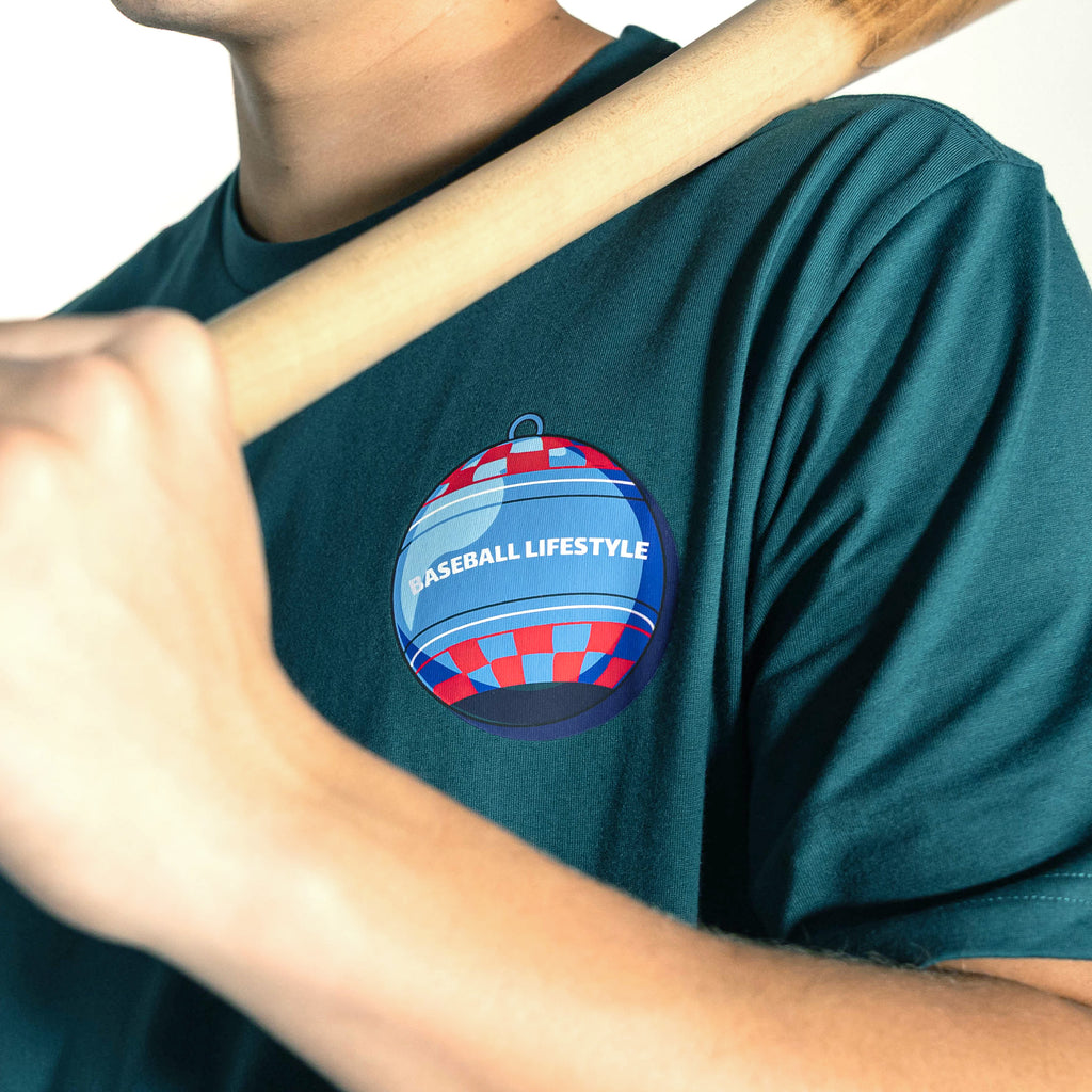 Adult model wearing teal graphic tee with "Bat Cracker" design