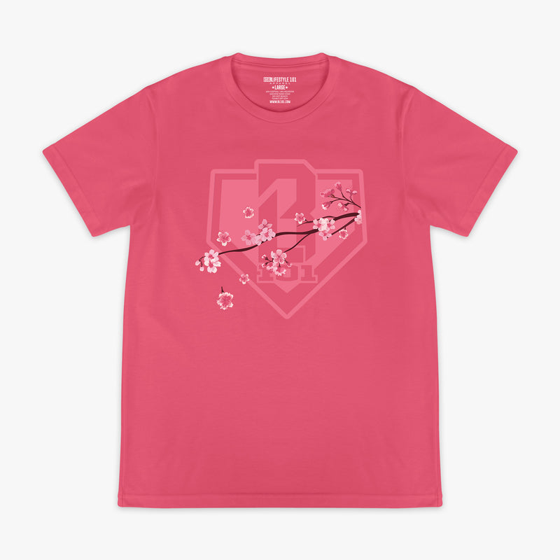 Pink BL101 tee with a tonal cherry blossom branch and home plate shield logo graphic on the chest, flat lay front view