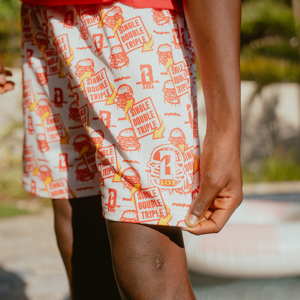 Adult model wearing shorts with "Burger" design