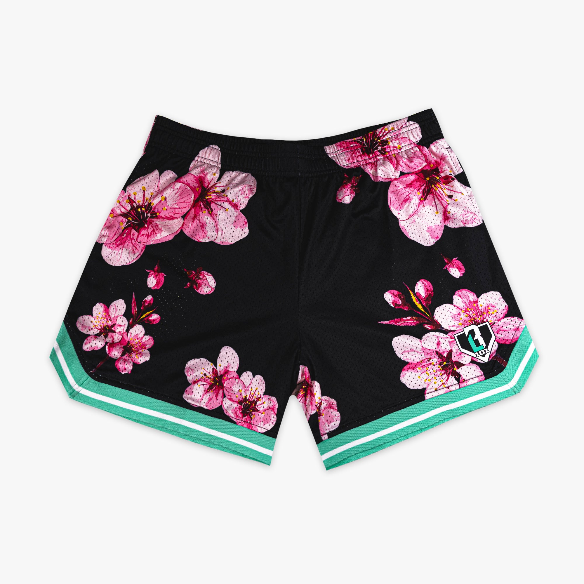 Black BL101 mesh shorts with an all-over pink cherry blossom print and teal and white striped hem, flat lay front view