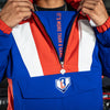 Person wearing a blue, red, and white jacket with 'IT'S MORE THAN A GAME' text and BL101 logo on chest.