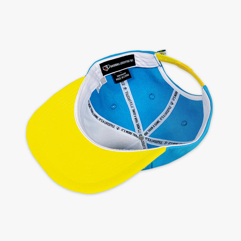Blue and yellow cap with Baseball Lifestyle 101  label on a white background