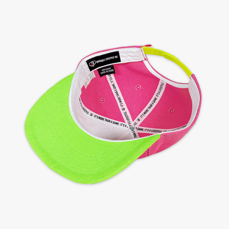 Pink and green cap with visible brand label on a white background