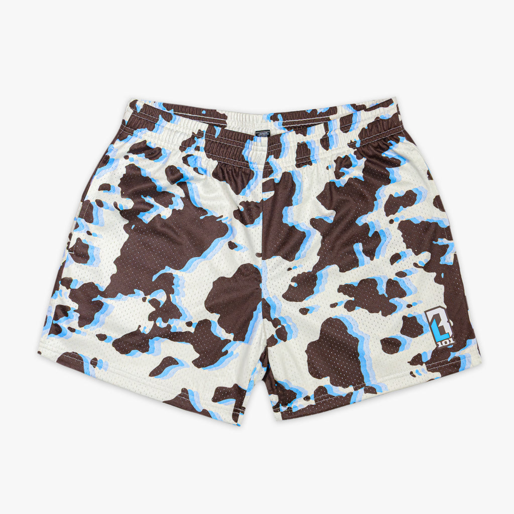 Cow print shorts with brown, black, and blue color way on a white background