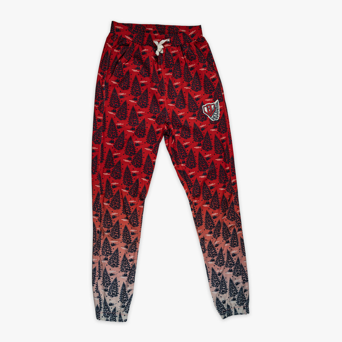 Red pajama pants with "Deck The Halls" design — front view