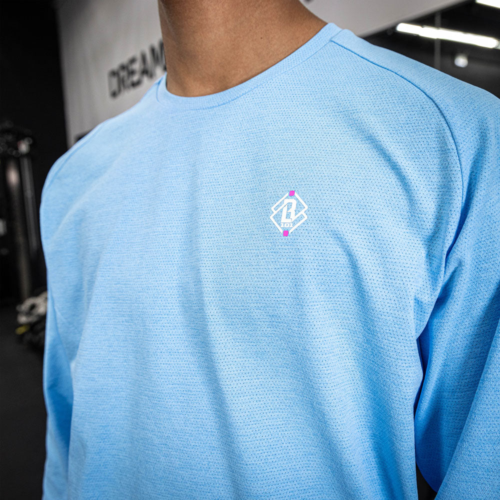 Adult model wearing blue Diamond Tech Long Sleeve Cotton Candy Blue long sleeve tee
