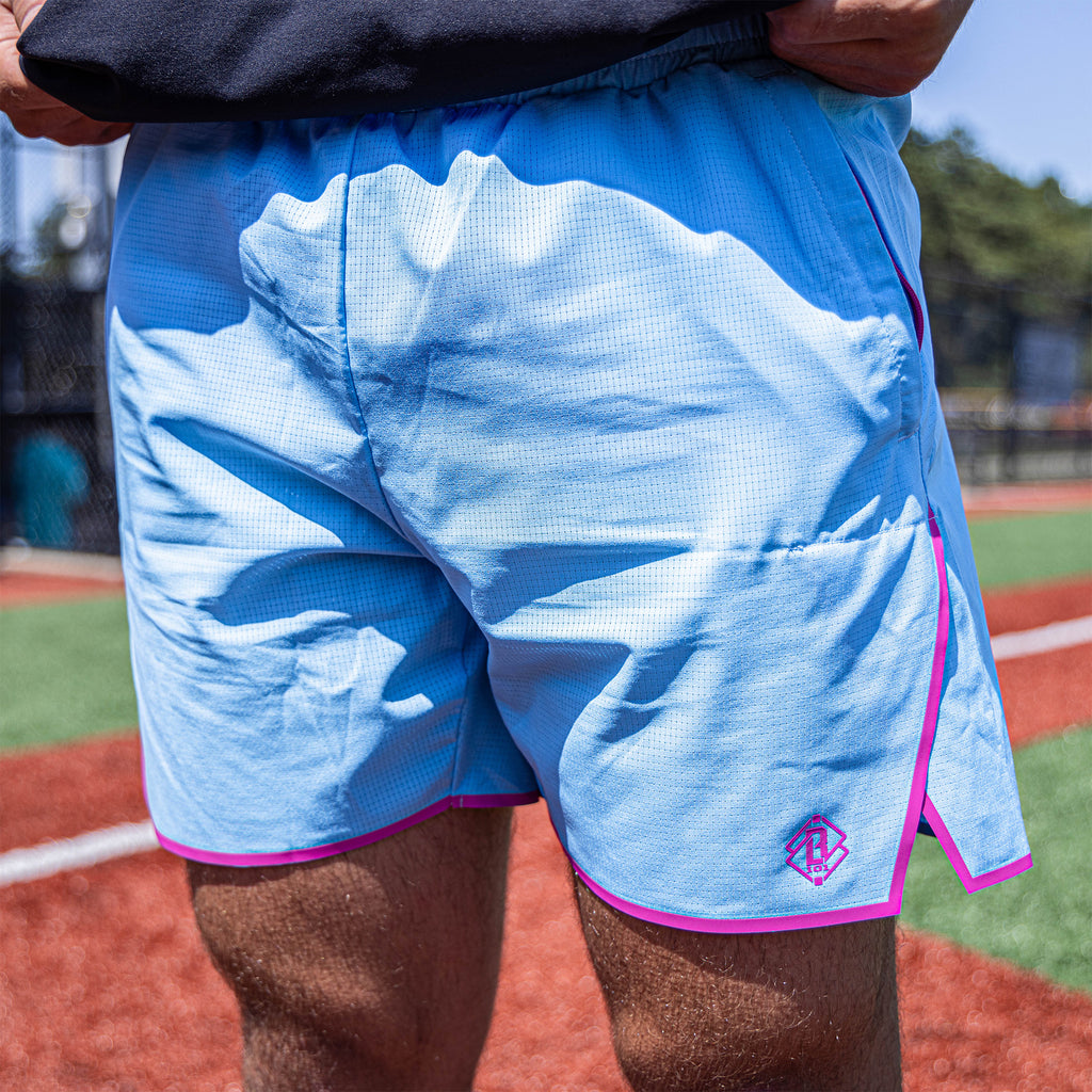 Adult model wearing blue Diamond Tech with Liner Cotton Candy shorts