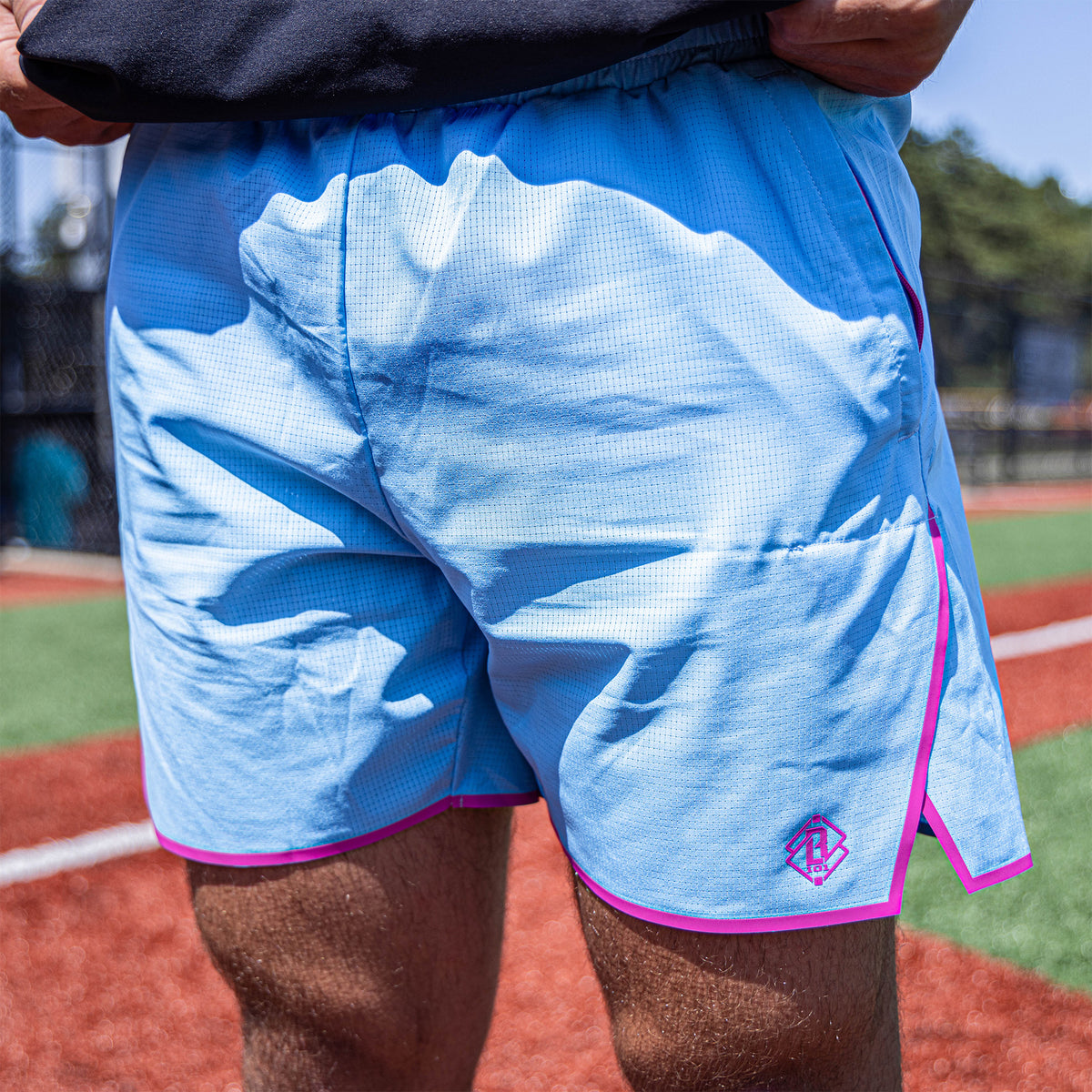 Adult model wearing blue Diamond Tech with Liner Cotton Candy shorts