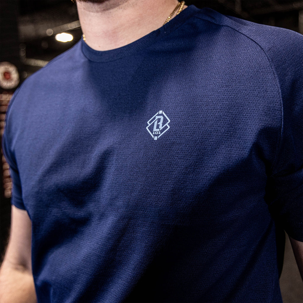 athlete wearing navy athletic shirt