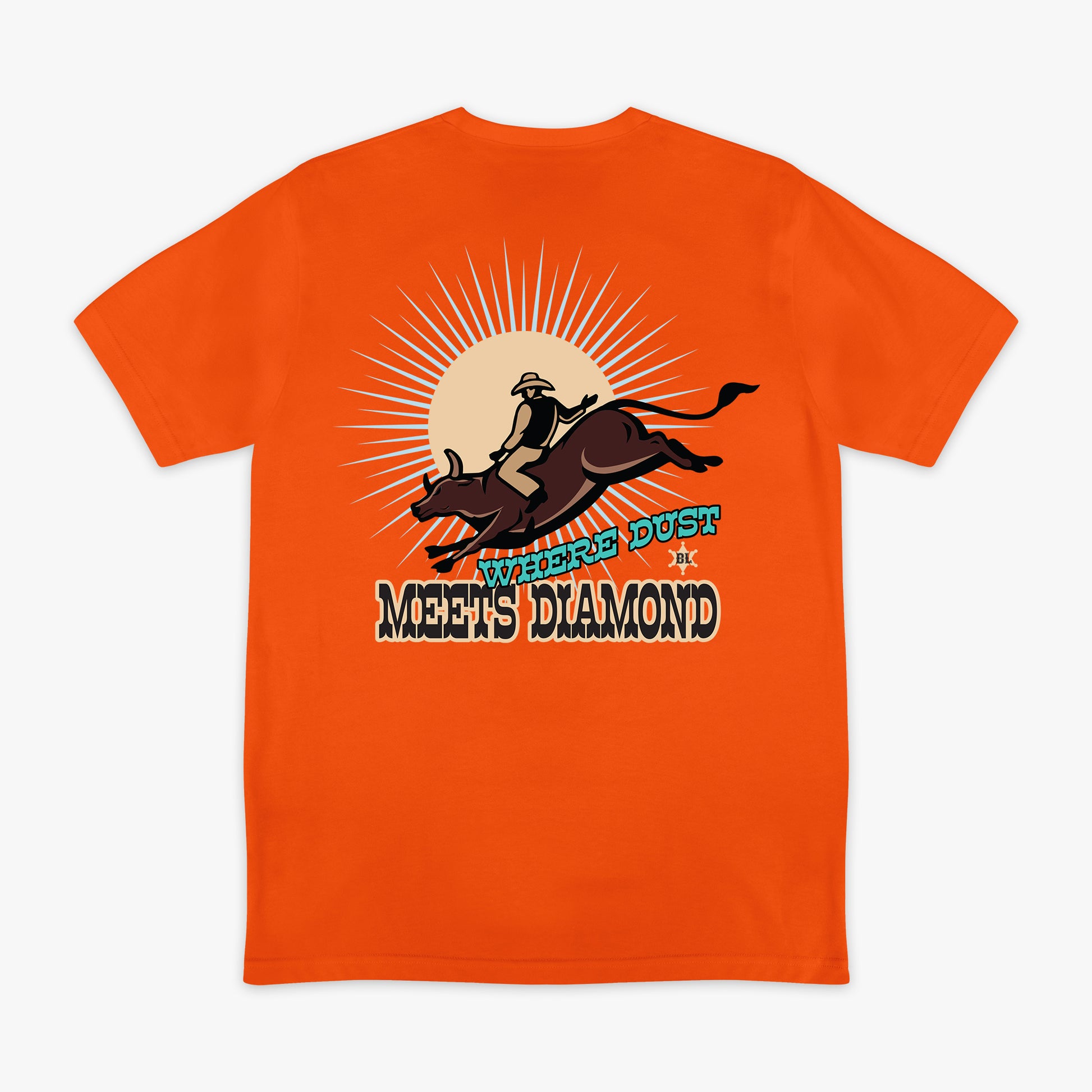 Orange t-shirt with a graphic of a person riding a bucking bronco and 'Where Dust Meets Diamond' text on a white background