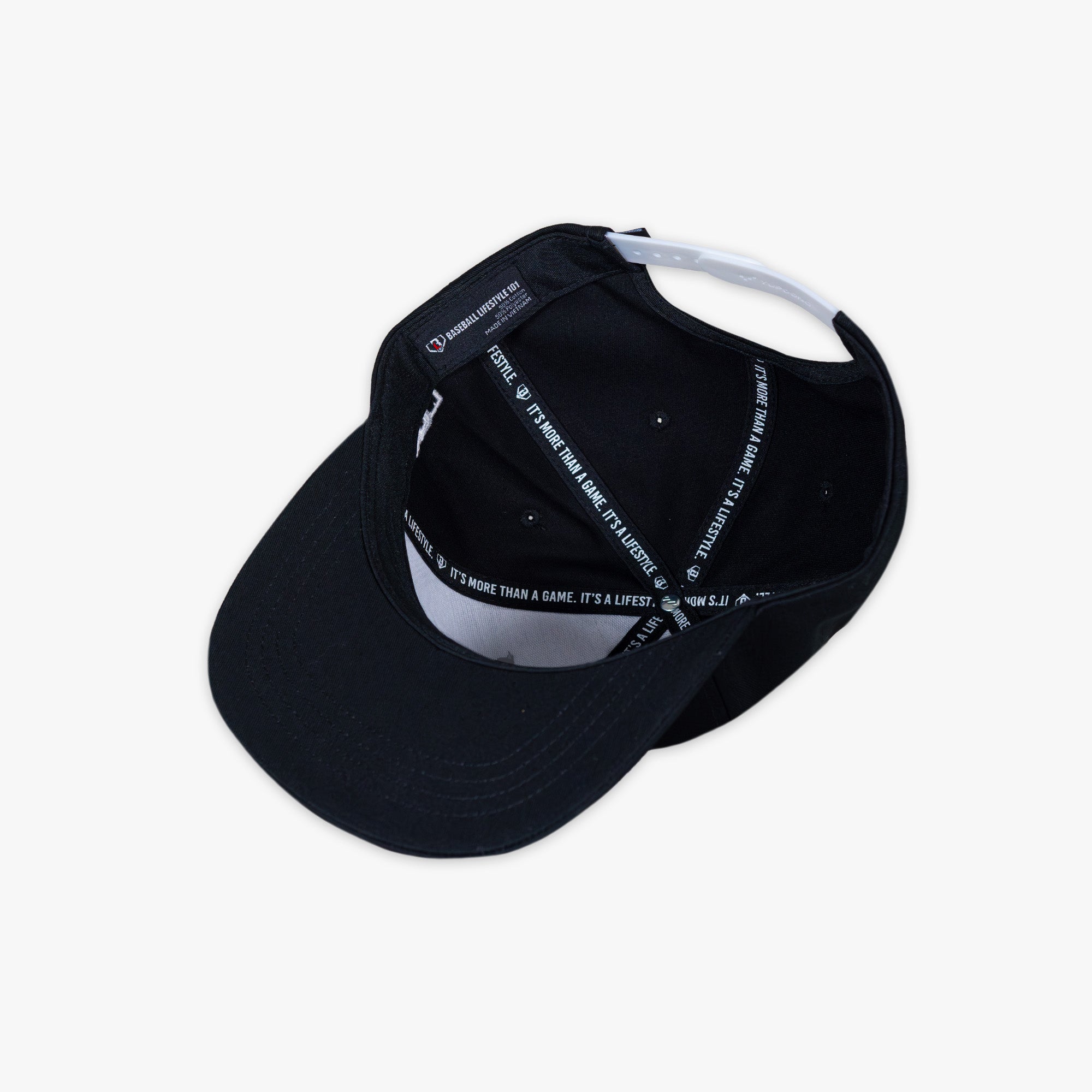 Black baseball cap with black 'Baseball Lifestyle 101' tag on a white background