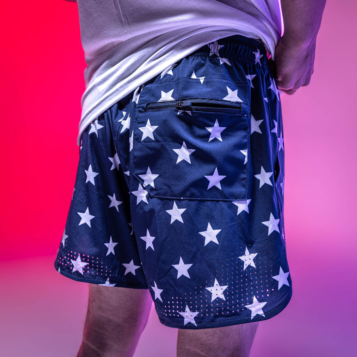Youth model wearing navy Pro Series Freedom youth shorts