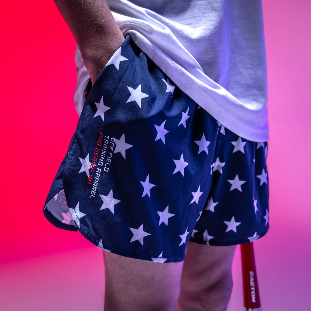 Youth model wearing navy Pro Series Freedom youth shorts